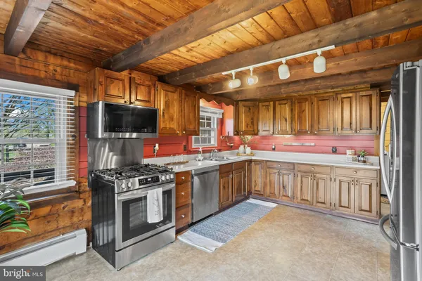 a kitchen with a refrigerator and a sink