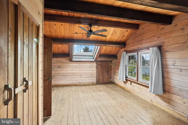 a view of front door with wooden floor