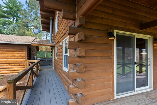 a view of a roof deck with wooden floor and fence