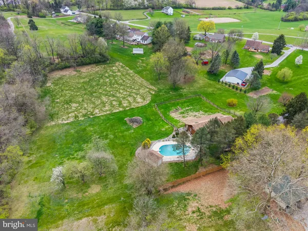 a view of swimming pool with a yard