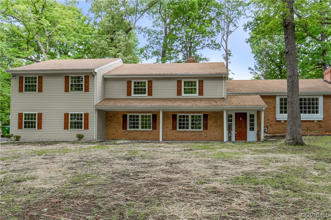 10240 Apache Road Richmond, VA 23235 - Photo 1 of 45 a front view of a house with a garden