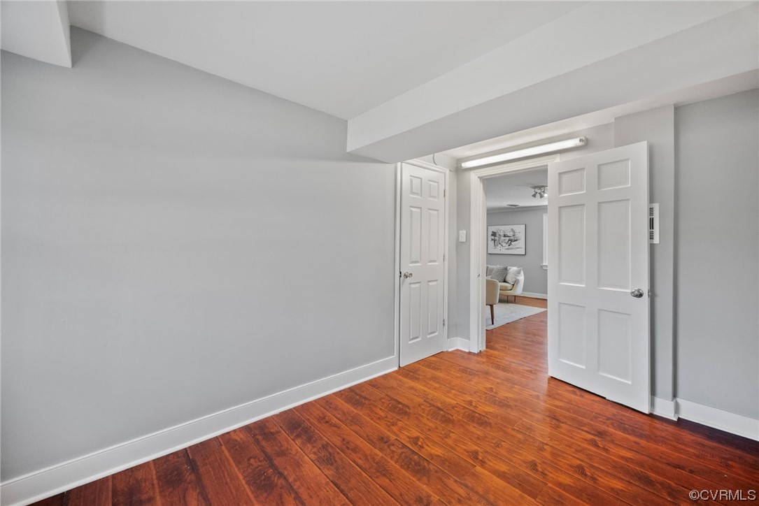 10240 Apache Road Richmond, VA 23235 - Photo 11 of 45 a view of an empty room with wooden floor and closet