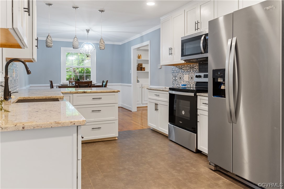 10240 Apache Road Richmond, VA 23235 - Photo 16 of 45 a kitchen with stainless steel appliances a refrigerator sink and cabinets