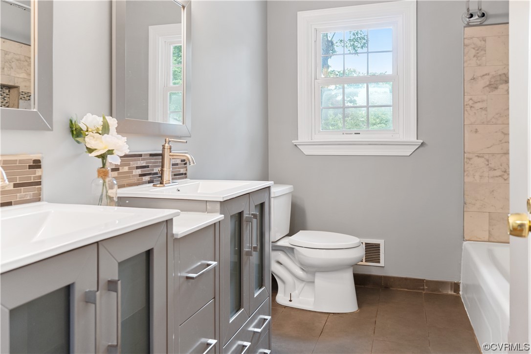 10240 Apache Road Richmond, VA 23235 - Photo 20 of 45 a bathroom with a sink toilet and a window