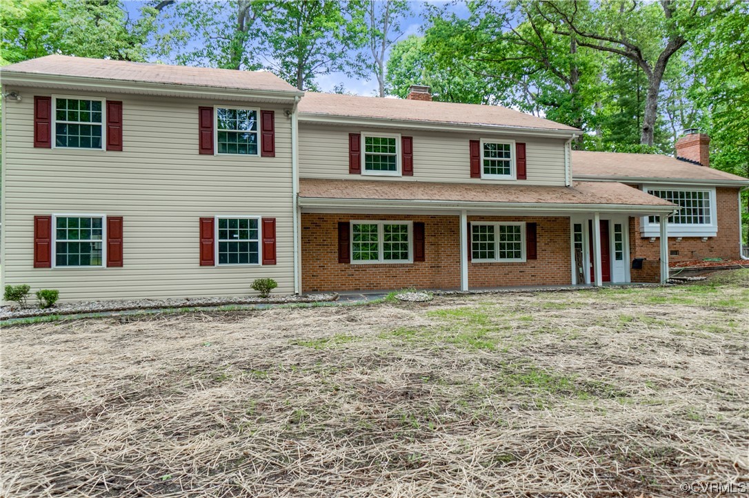 10240 Apache Road Richmond, VA 23235 - Photo 2 of 45 a front view of a house with a garden