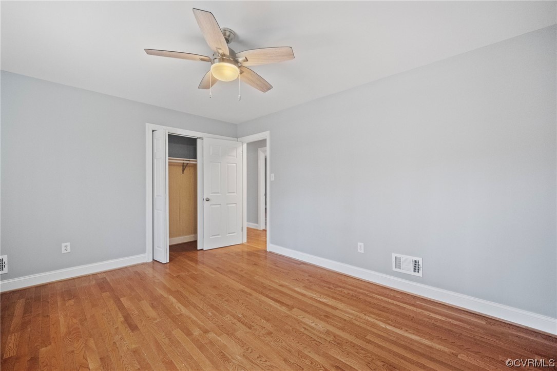10240 Apache Road Richmond, VA 23235 - Photo 24 of 45 a view of a room with wooden floor and a ceiling fan