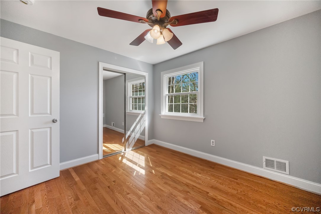 10240 Apache Road Richmond, VA 23235 - Photo 26 of 45 a view of room with window ceiling fan and hardwood floor