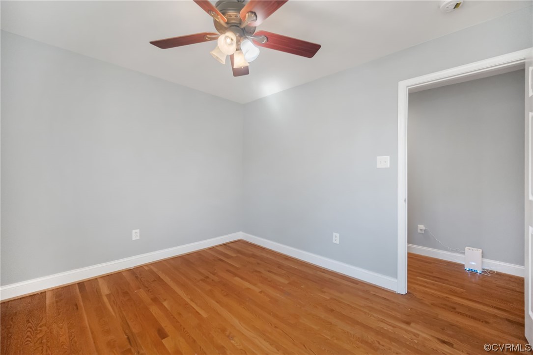 10240 Apache Road Richmond, VA 23235 - Photo 27 of 45 an empty room with wooden floor and fan