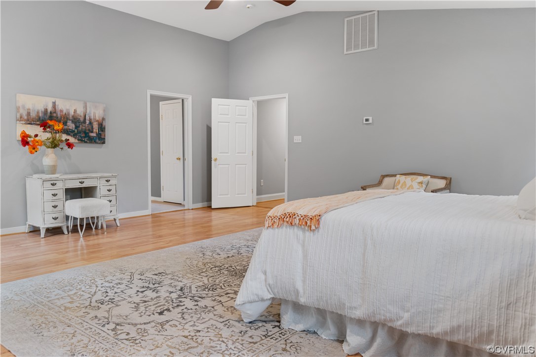 10240 Apache Road Richmond, VA 23235 - Photo 30 of 45 a bedroom with a bed and a table in it