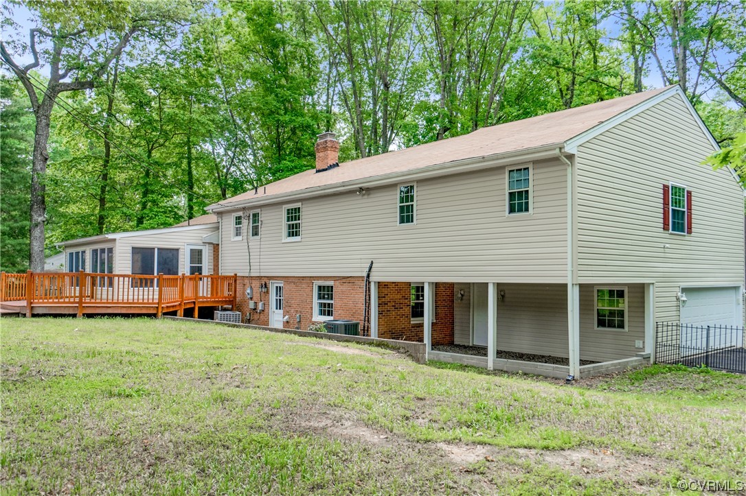 10240 Apache Road Richmond, VA 23235 - Photo 37 of 45 a view of a house with a yard and sitting area