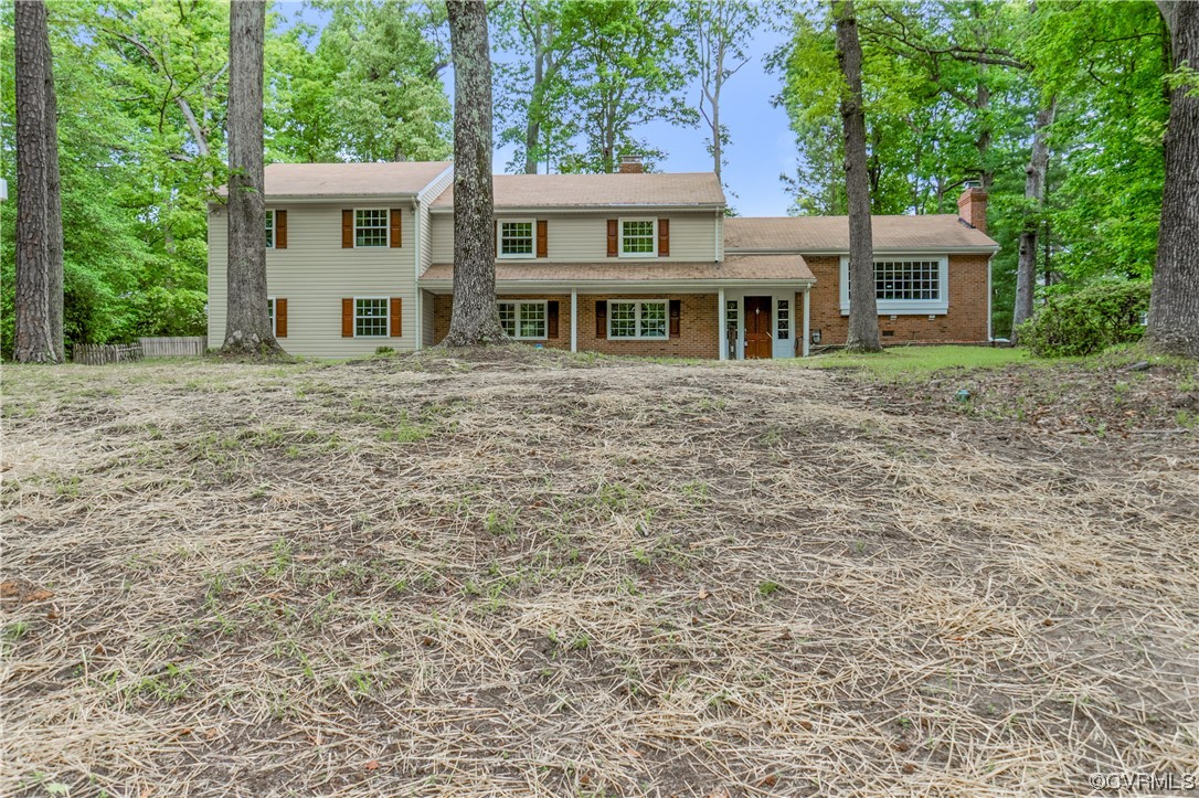 10240 Apache Road Richmond, VA 23235 - Photo 4 of 45 a front view of a house with yard and trees