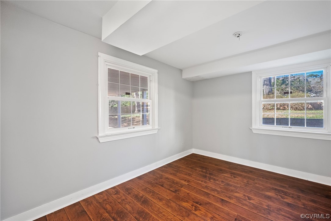 10240 Apache Road Richmond, VA 23235 - Photo 10 of 45 a view of an empty room with wooden floor and a window