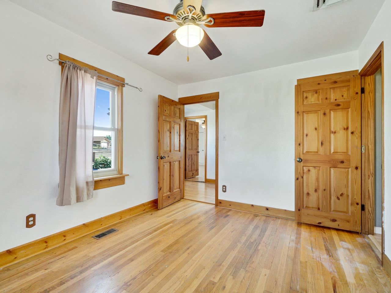 2278 H Road Grand Junction, CO 81505 - Photo 17 of 38 a view of an empty room with window and wooden floor