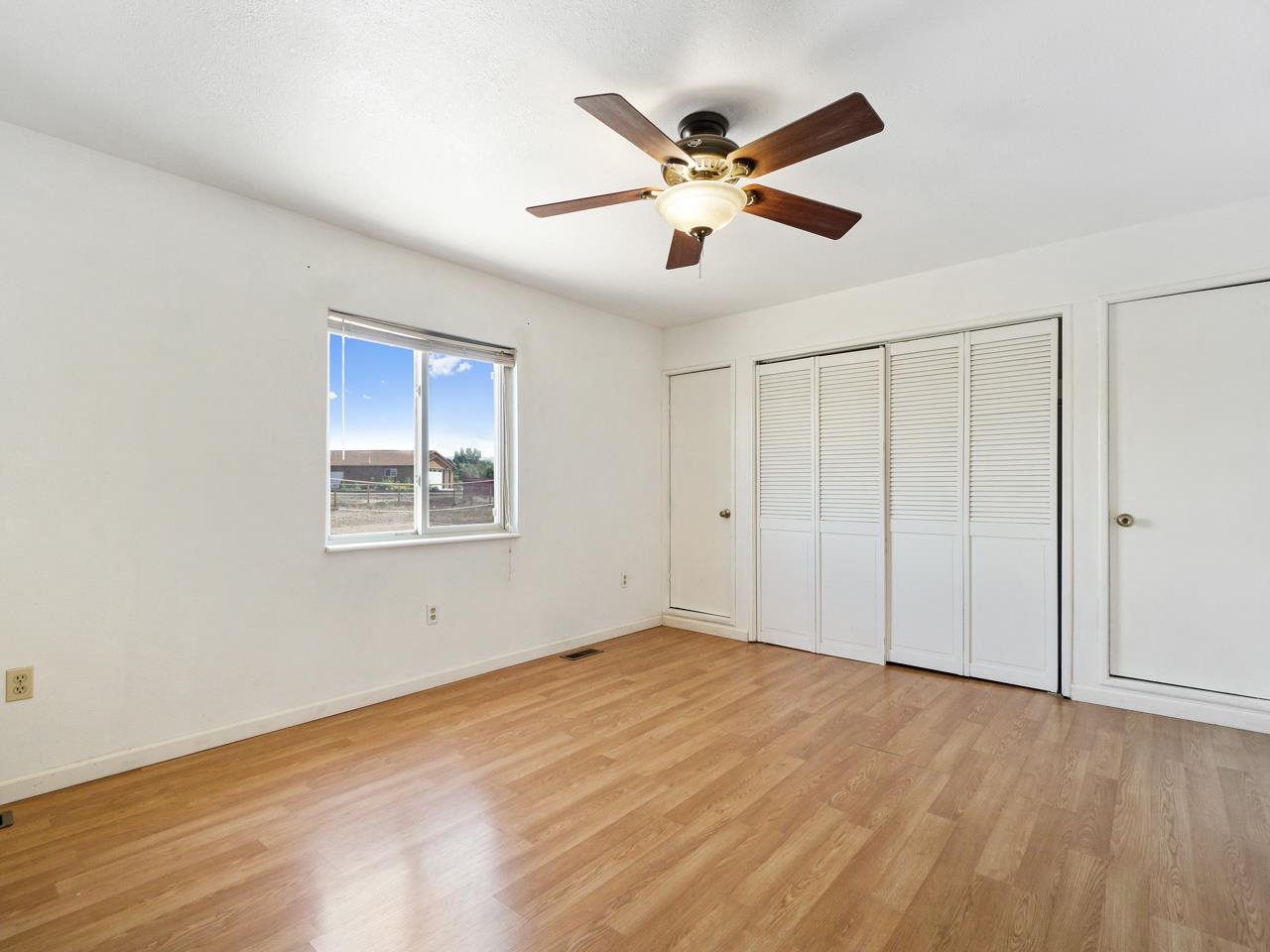 2278 H Road Grand Junction, CO 81505 - Photo 18 of 38 a view of empty room with wooden floor and fan