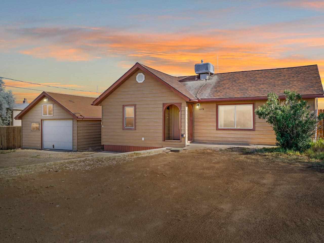 2278 H Road Grand Junction, CO 81505 - Photo 2 of 38 a view of a house with a yard