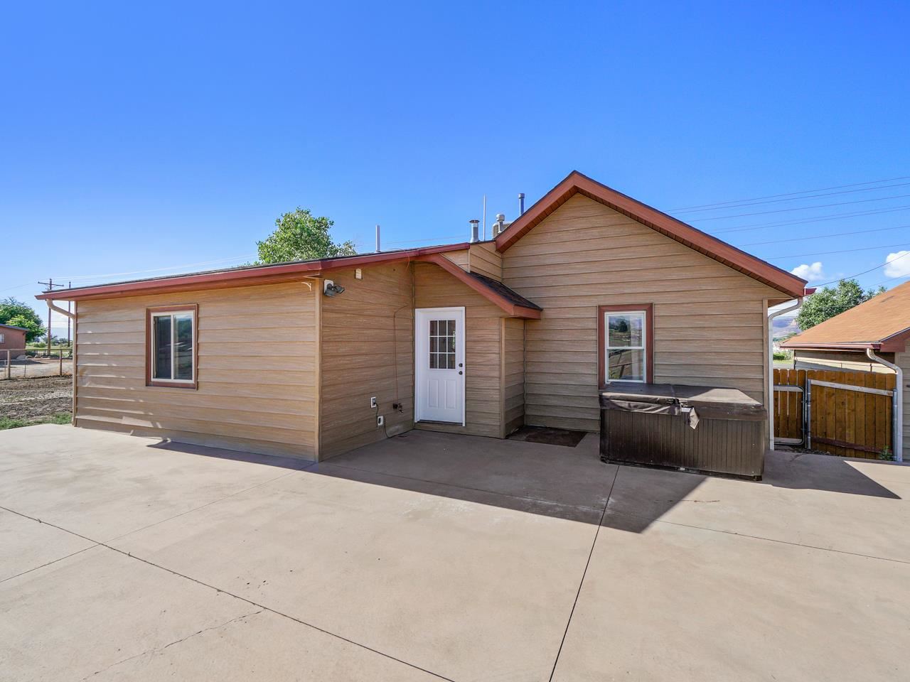 2278 H Road Grand Junction, CO 81505 - Photo 22 of 38 a view of a house with a backyard and a couch