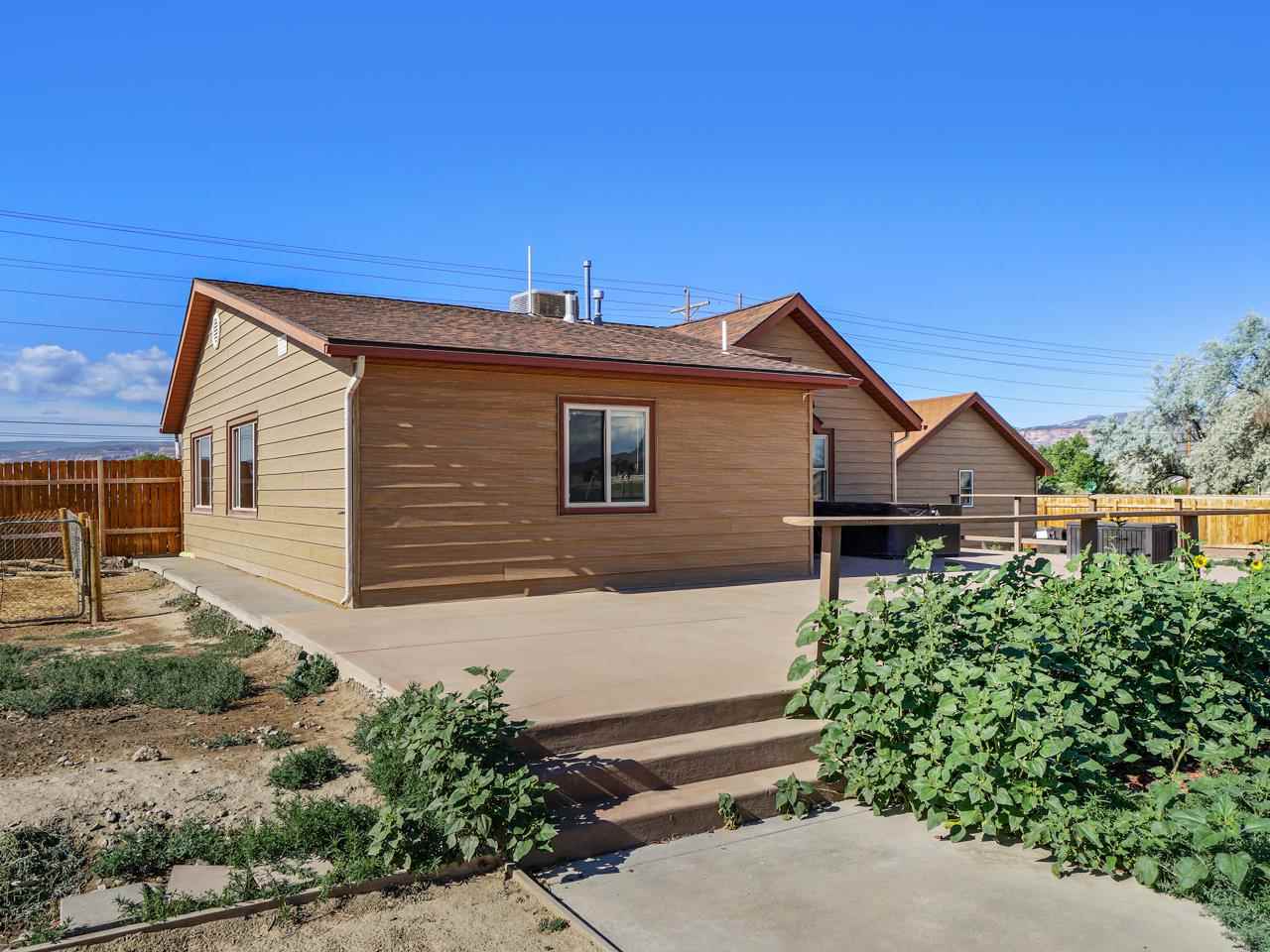 2278 H Road Grand Junction, CO 81505 - Photo 23 of 38 a view of a house with a small yard