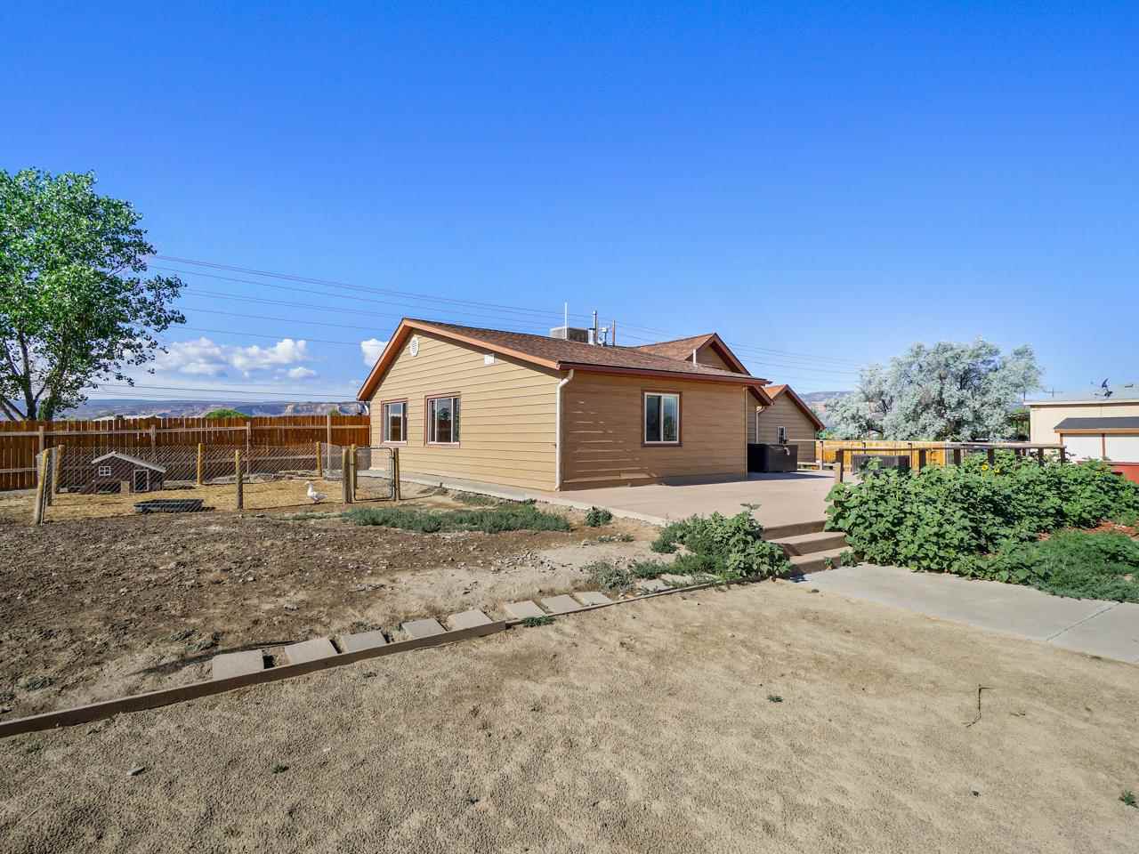 2278 H Road Grand Junction, CO 81505 - Photo 24 of 38 a view of a house with a yard