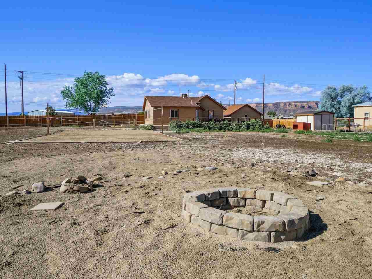 2278 H Road Grand Junction, CO 81505 - Photo 33 of 38 a view of a dry yard with wooden fence