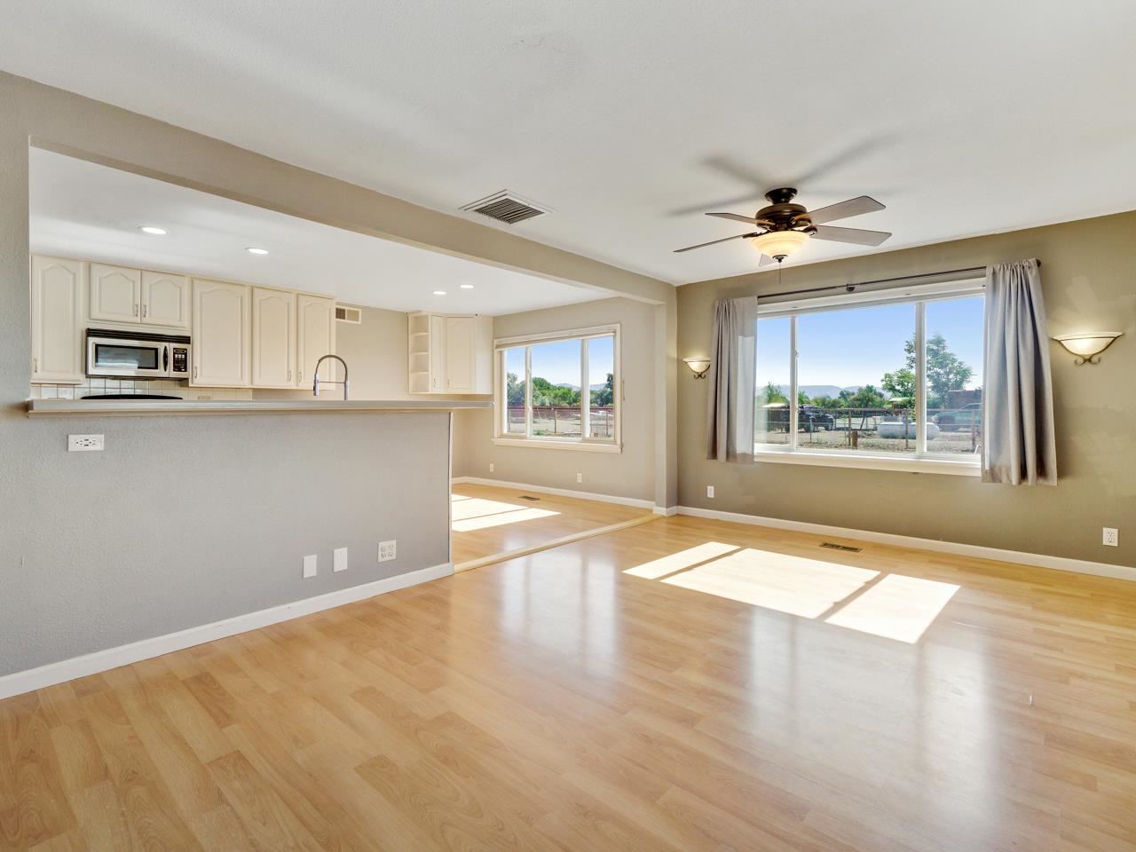 2278 H Road Grand Junction, CO 81505 - Photo 7 of 38 a view of an empty room with window and wooden floor