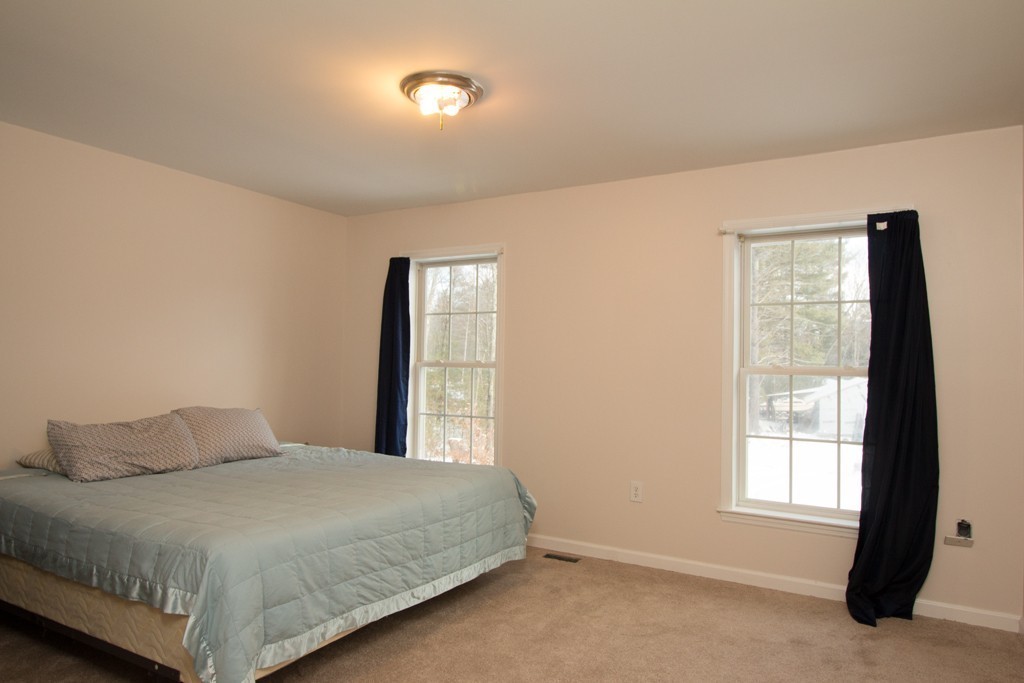 10 Cobb Hill Road Phillipston, MA 01331 - Photo 7 of 25 a bedroom with a bed and a window