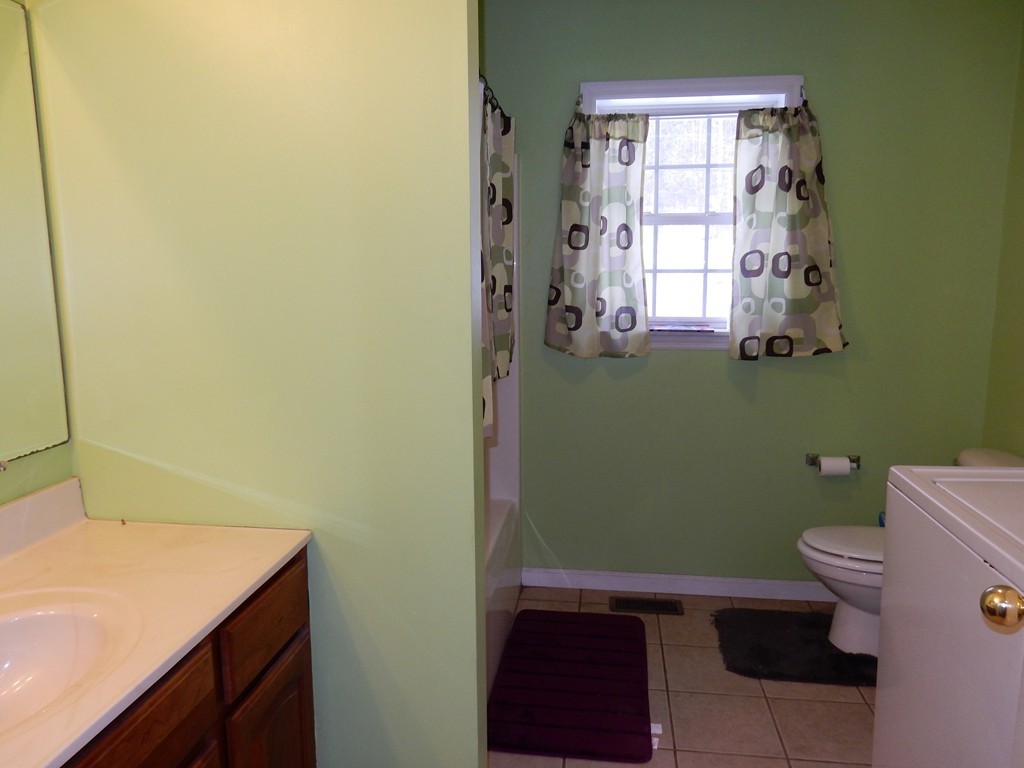 10 Cobb Hill Road Phillipston, MA 01331 - Photo 8 of 25 a bathroom with a sink a toilet and a window