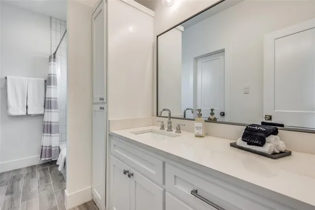 a bathroom with a sink double vanity and a mirror