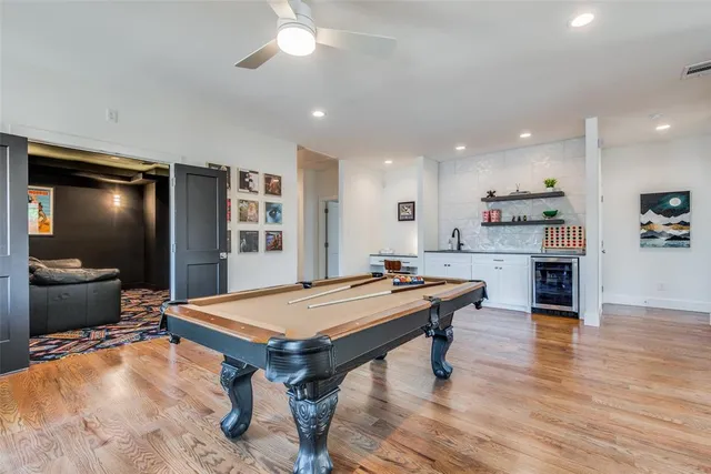 a room with furniture and pool table