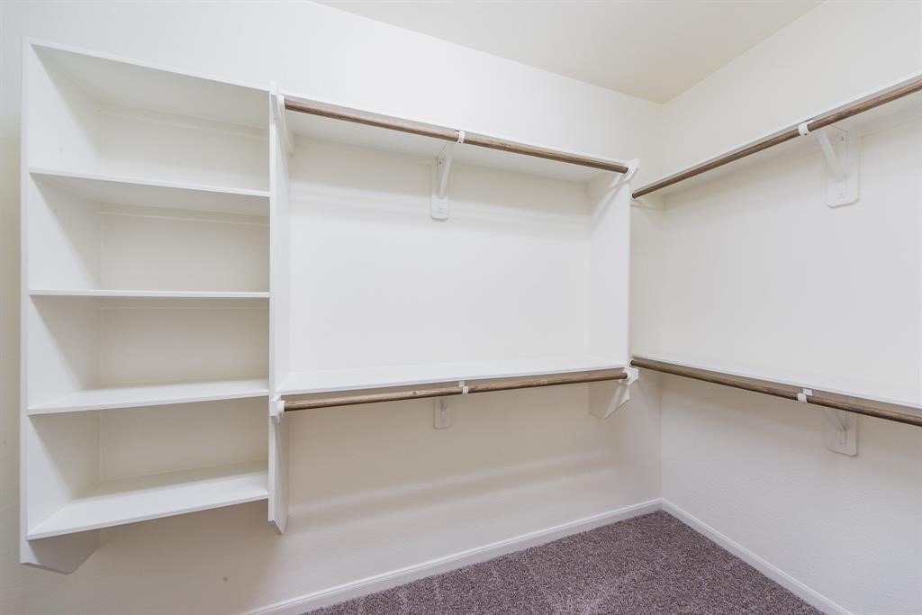 3219 Montclair Orchard Trace Spring, TX 77386 - Photo 17 of 27 a view of an empty walk in closet