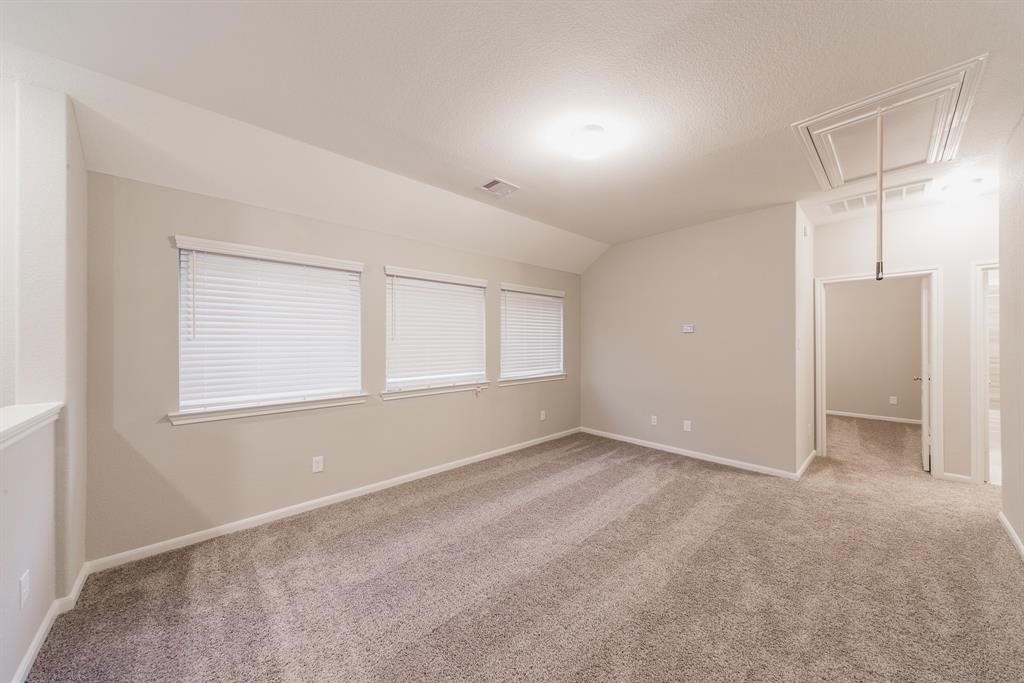3219 Montclair Orchard Trace Spring, TX 77386 - Photo 20 of 27 a view of an empty room with a window
