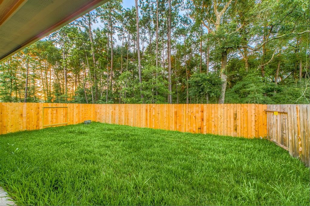 3219 Montclair Orchard Trace Spring, TX 77386 - Photo 27 of 27 a view of yard with swimming pool and trees in the background