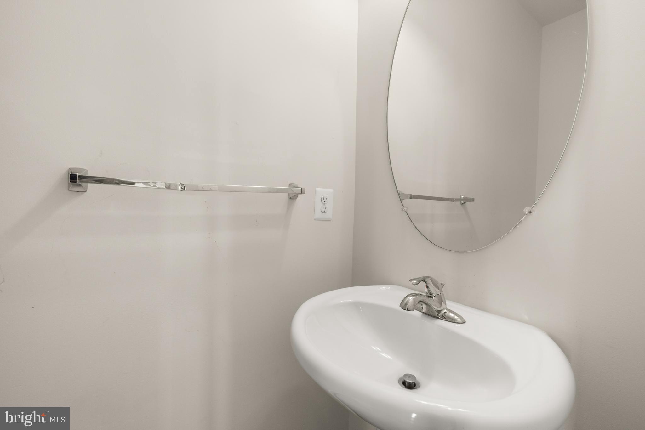 111 Rotunda Drive Stephenson, VA 22656 - Photo 28 of 33 a bathroom with a sink and a mirror