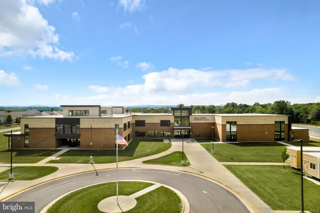 an aerial view of a residential apartment building with a outdoor space