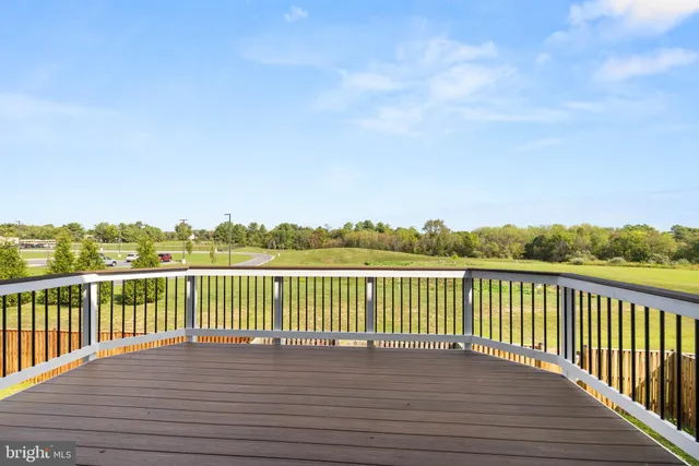 a view of balcony with wooden floor