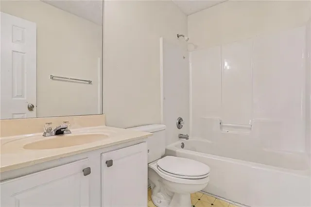 a bathroom with a sink a toilet and a bathtub