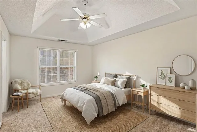 a bedroom with a bed and window