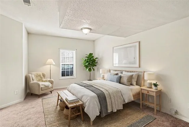 a bedroom with a bed and window