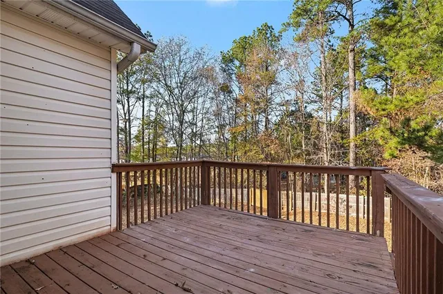 a view of balcony with wooden floor