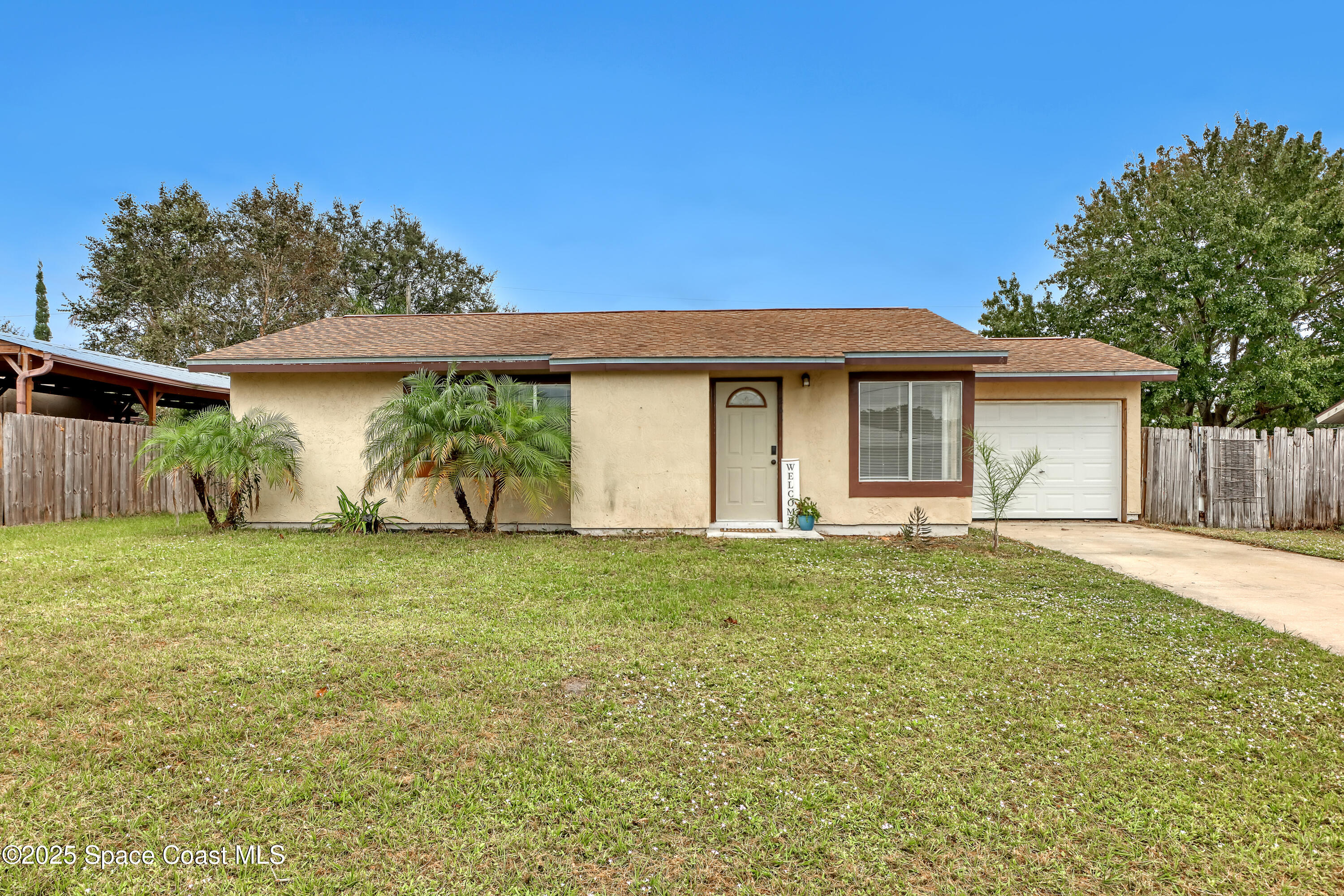 261 Chase Road Cocoa, FL 32927 - Photo 1 of 26 a house view with a garden space
