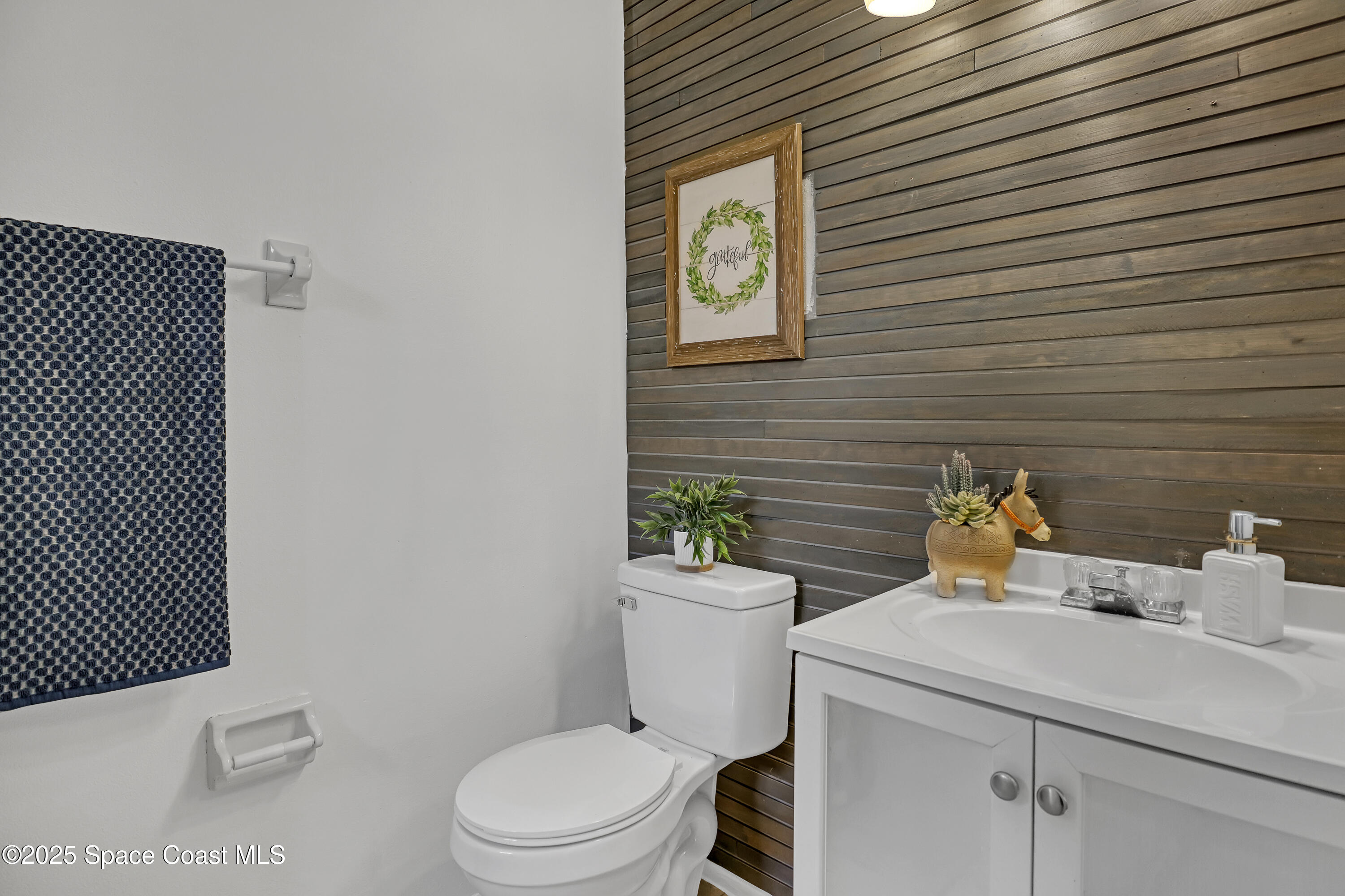 261 Chase Road Cocoa, FL 32927 - Photo 17 of 26 a bathroom with a toilet and a sink