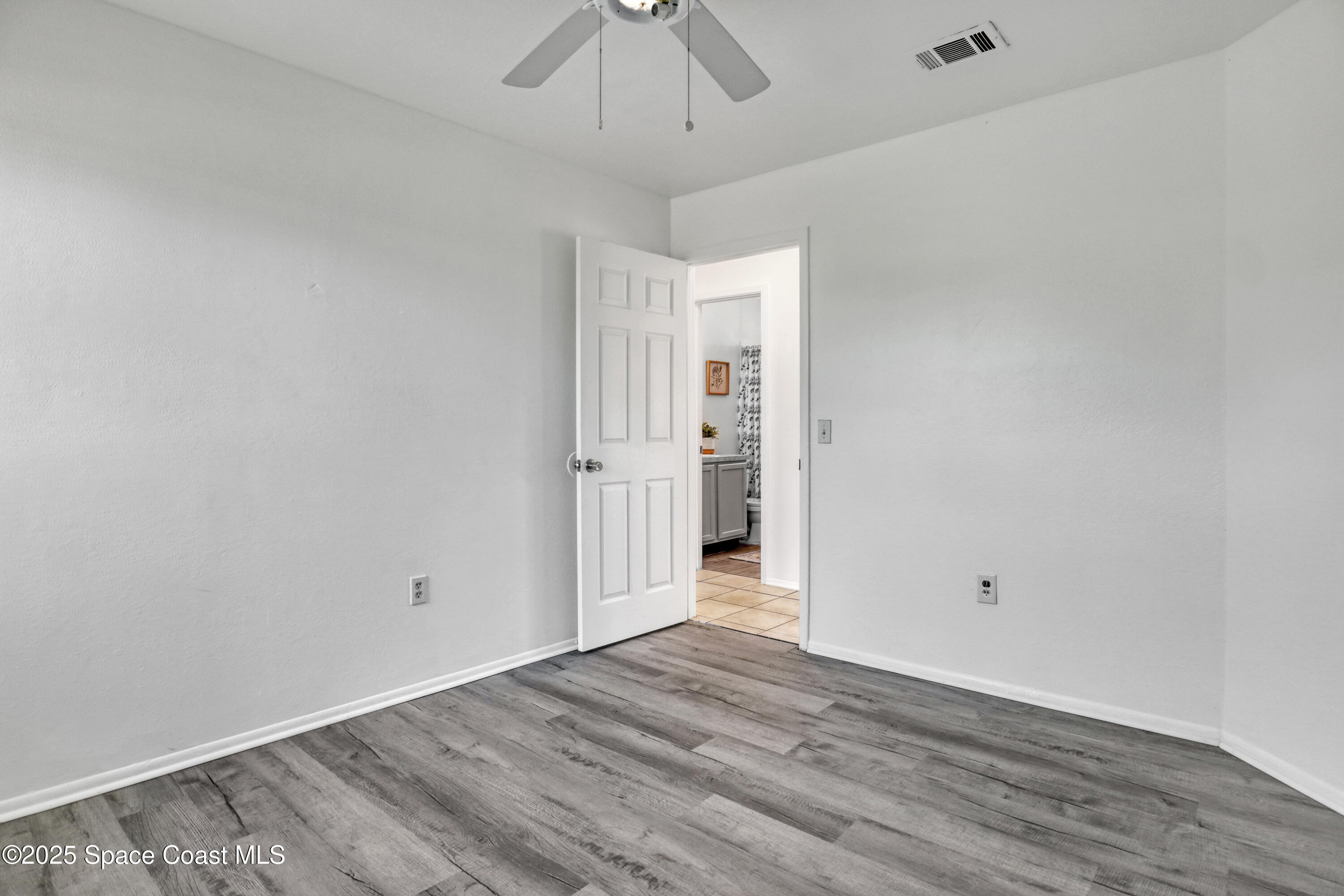 261 Chase Road Cocoa, FL 32927 - Photo 19 of 26 wooden floor in an empty room