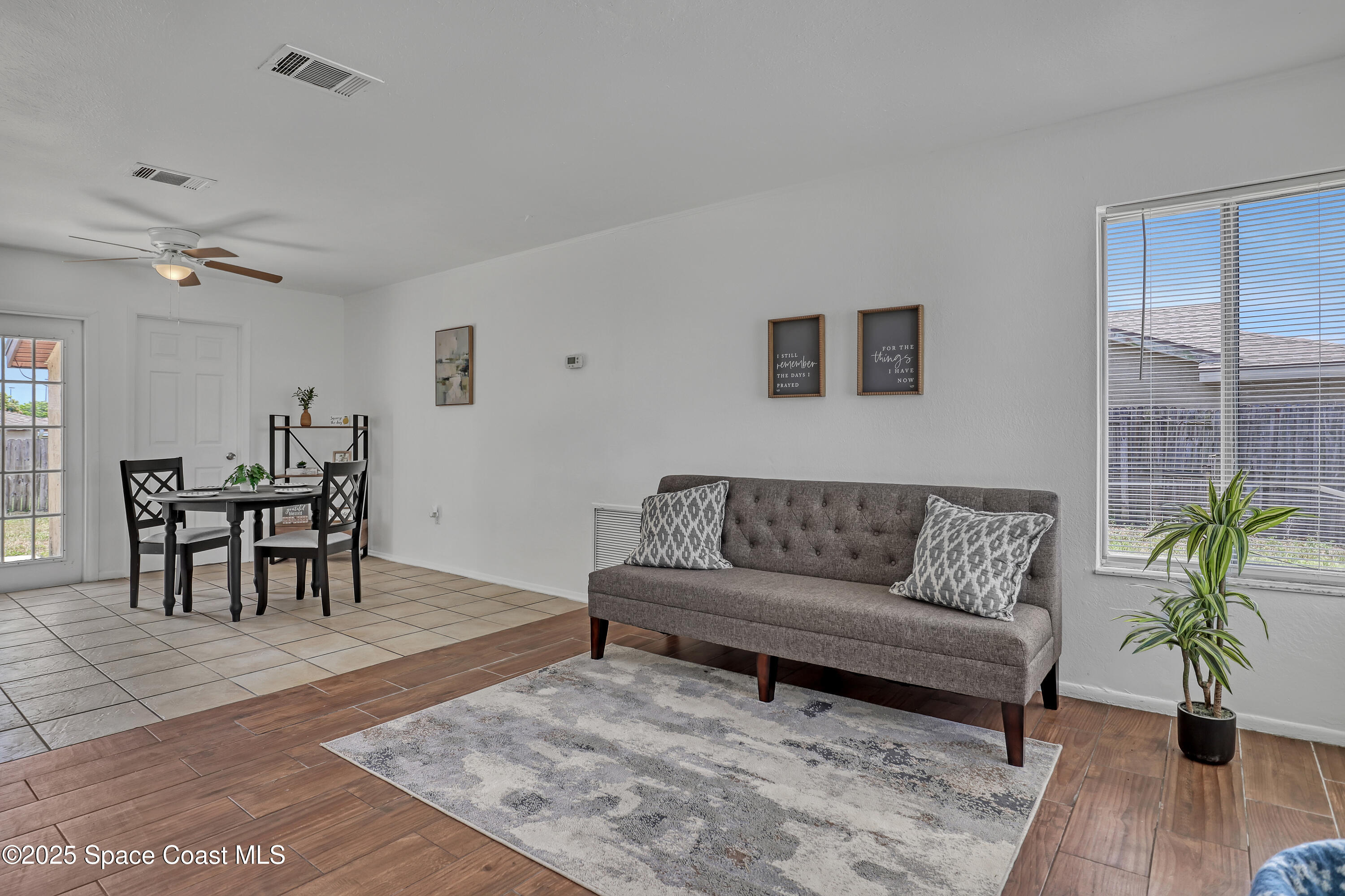261 Chase Road Cocoa, FL 32927 - Photo 2 of 26 a living room with furniture and a wooden floor