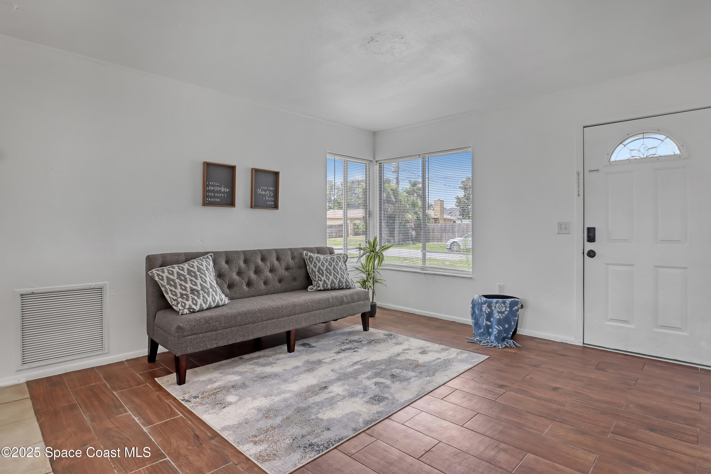 261 Chase Road Cocoa, FL 32927 - Photo 3 of 26 a living room with furniture and wooden floor