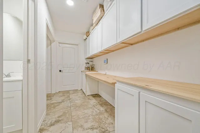 a view of a kitchen with cabinets