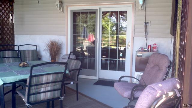 534 Mountain View Road Nazareth, PA 18064 - Photo 16 of 40 Covered patio with ceiling fan, Anderson sliders.