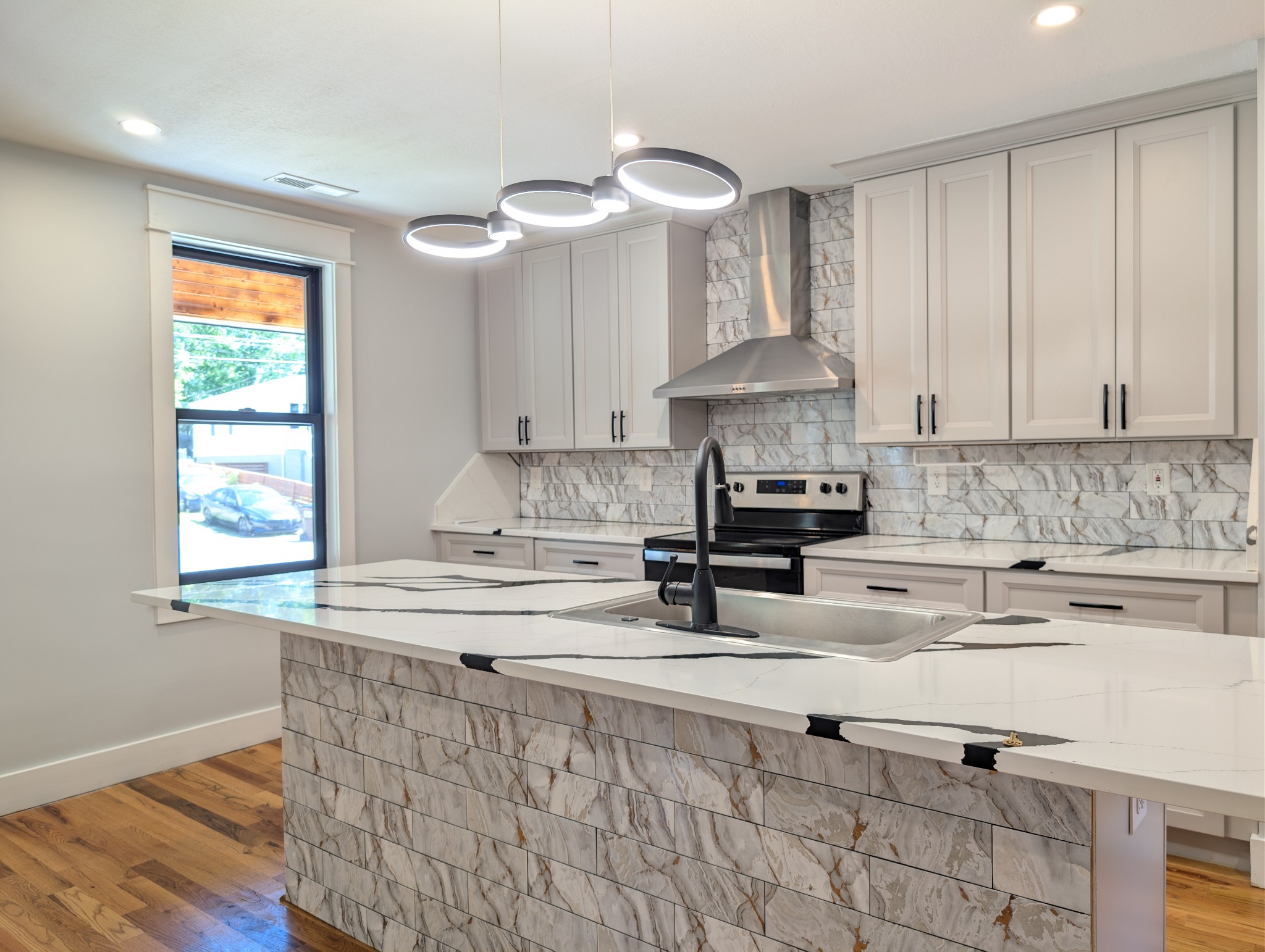 244 Warrior Road Madison, TN 37115 - Photo 5 of 24 a kitchen with stainless steel appliances granite countertop a sink and cabinets