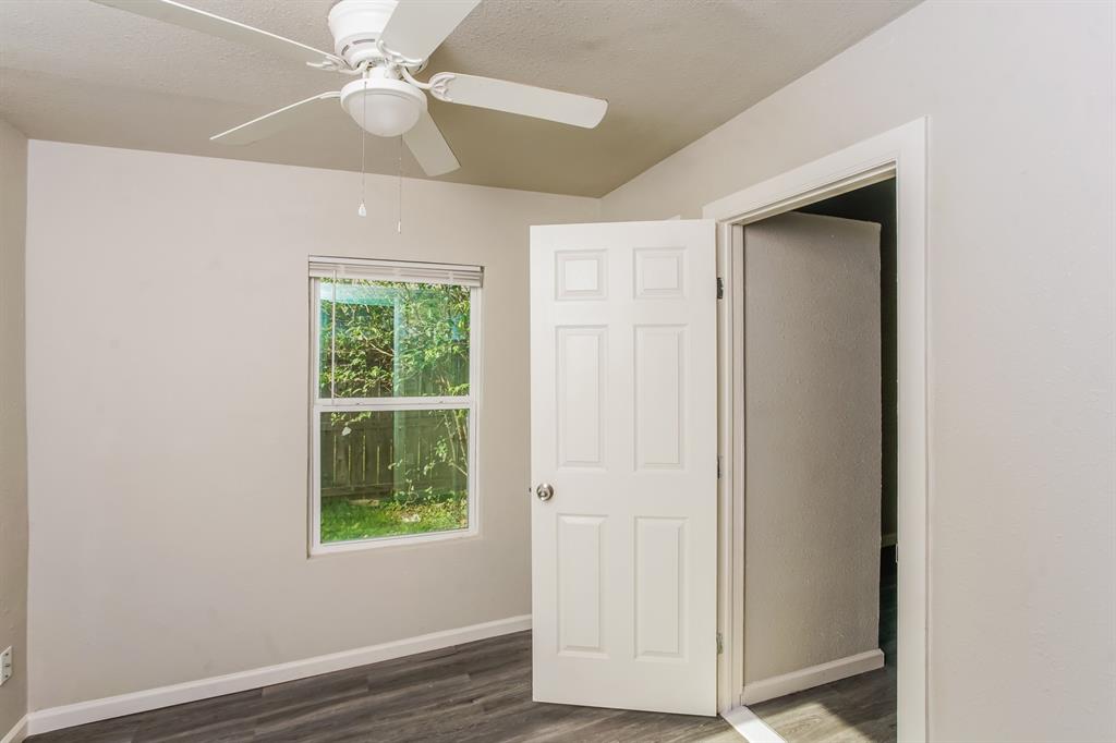 2402 Summer Avenue Waco, TX 76708 - Photo 11 of 15 Room featuring light gray painted walls and wood-finish flooring
