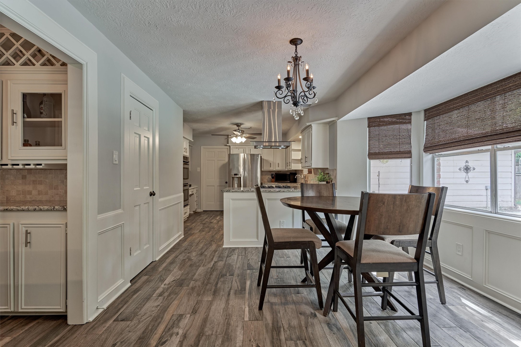 6522 Castle Pine Lane Spring, TX 77379 - Photo 27 of 49 a view of a dining room with furniture wooden floor and chandelier