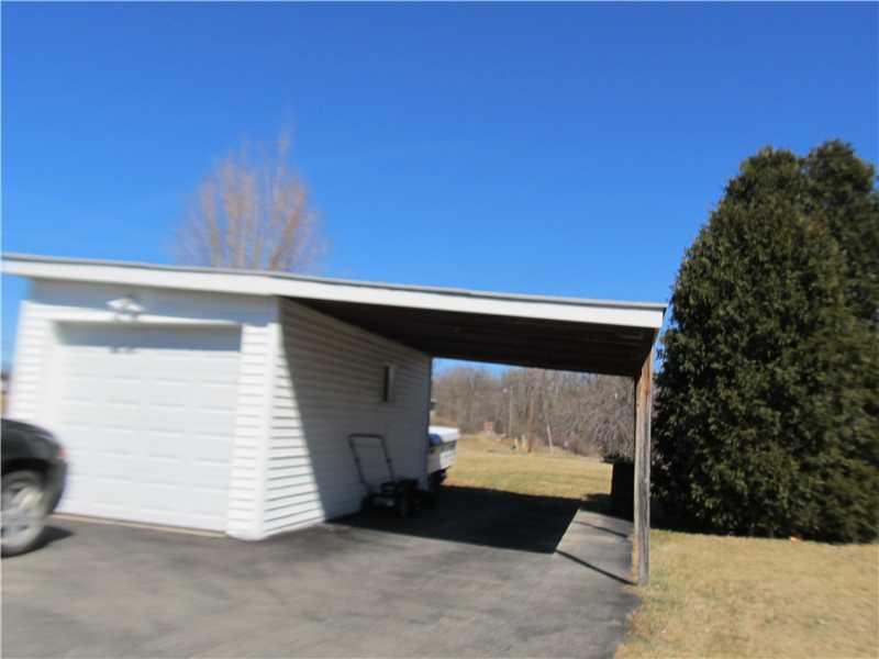 712 Cemetery Road Perryopolis, PA 15473 - Photo 2 of 8 Parking Lot/Garage. 1 car detached garage with an attached car port, asphalt drive with room to park 4/5 cars