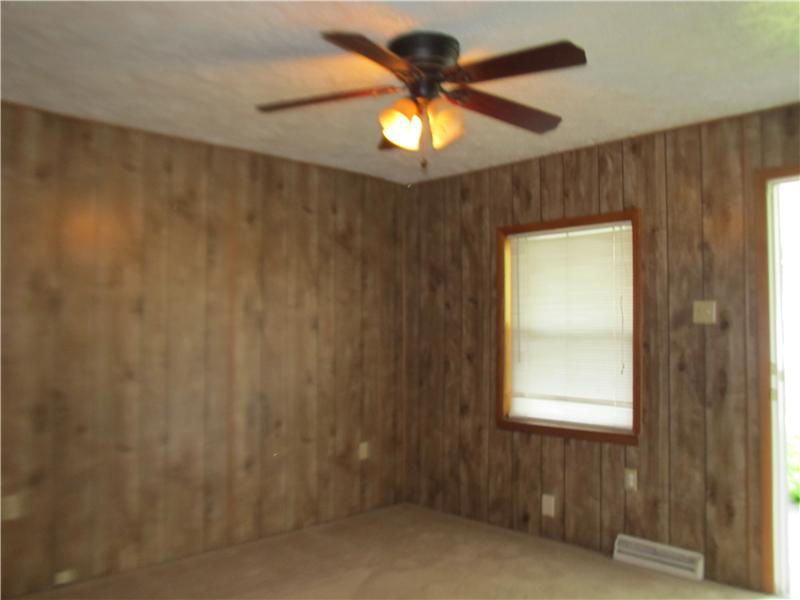 712 Cemetery Road Perryopolis, PA 15473 - Photo 4 of 8 Living Room. 12 x 11 paneled living room